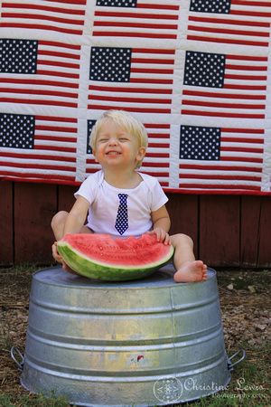 child, portraits, professional, chattanooga, tn, tennessee, patriotic, red, white, blue, american flag, quilt, clothes line, 2 year old, blonde, boy, pictures, photographs, watermelon