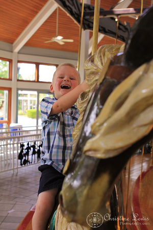 children photography, pictures, portraits, professional, Coolidge Park, carousel, laughing