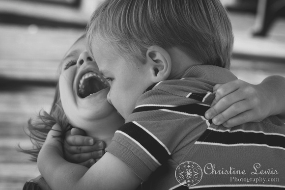 family photo shoot, portrait session, chattanooga, TN, downtown, coolidge park, "Christine Lewis Photography", outdoor, natural, lifestyle photography, laughing, siblings, brother and sister, black and white